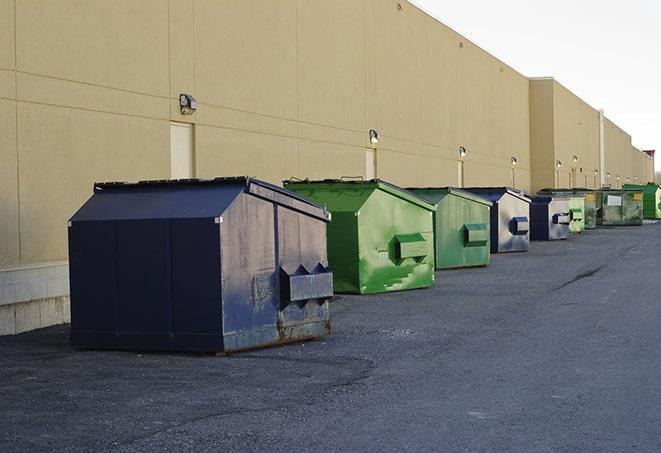 metal dump boxes positioned for construction cleanup in Brownsville